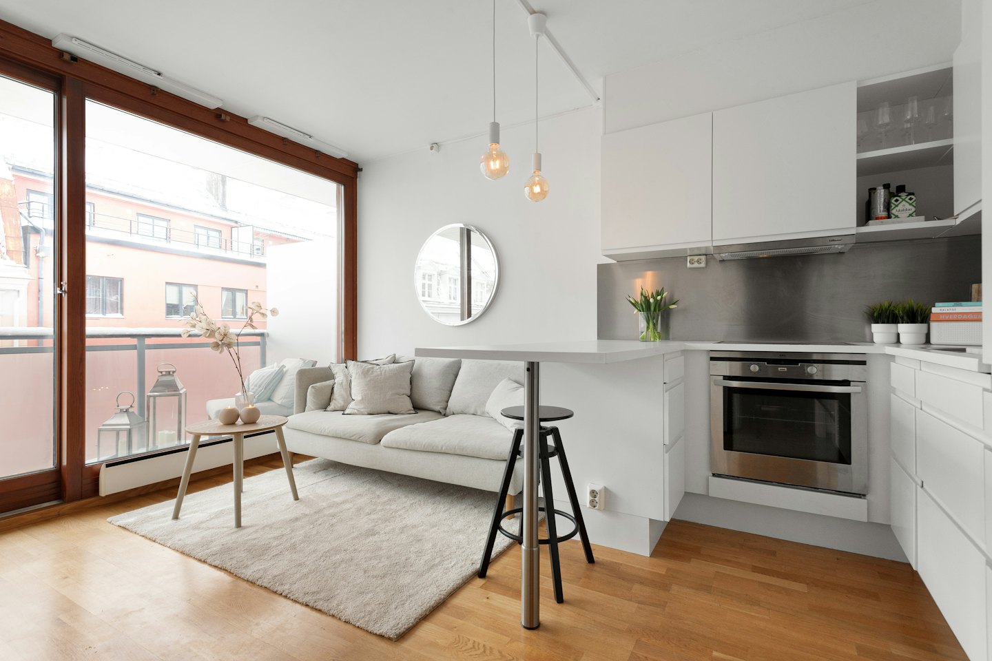 Modern open plan studio apartment with kitchen and living area.